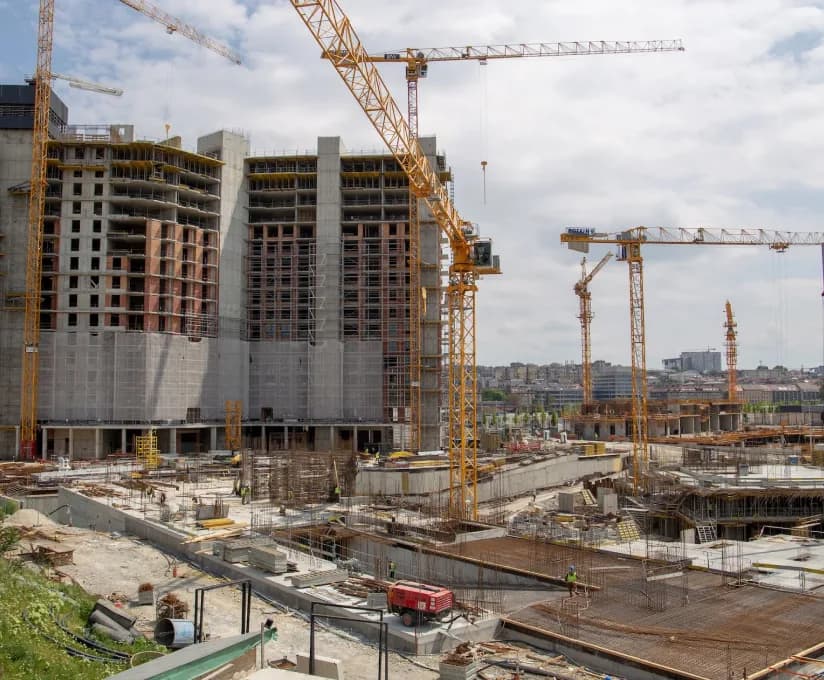 Construction site with excavation and concrete work in progress